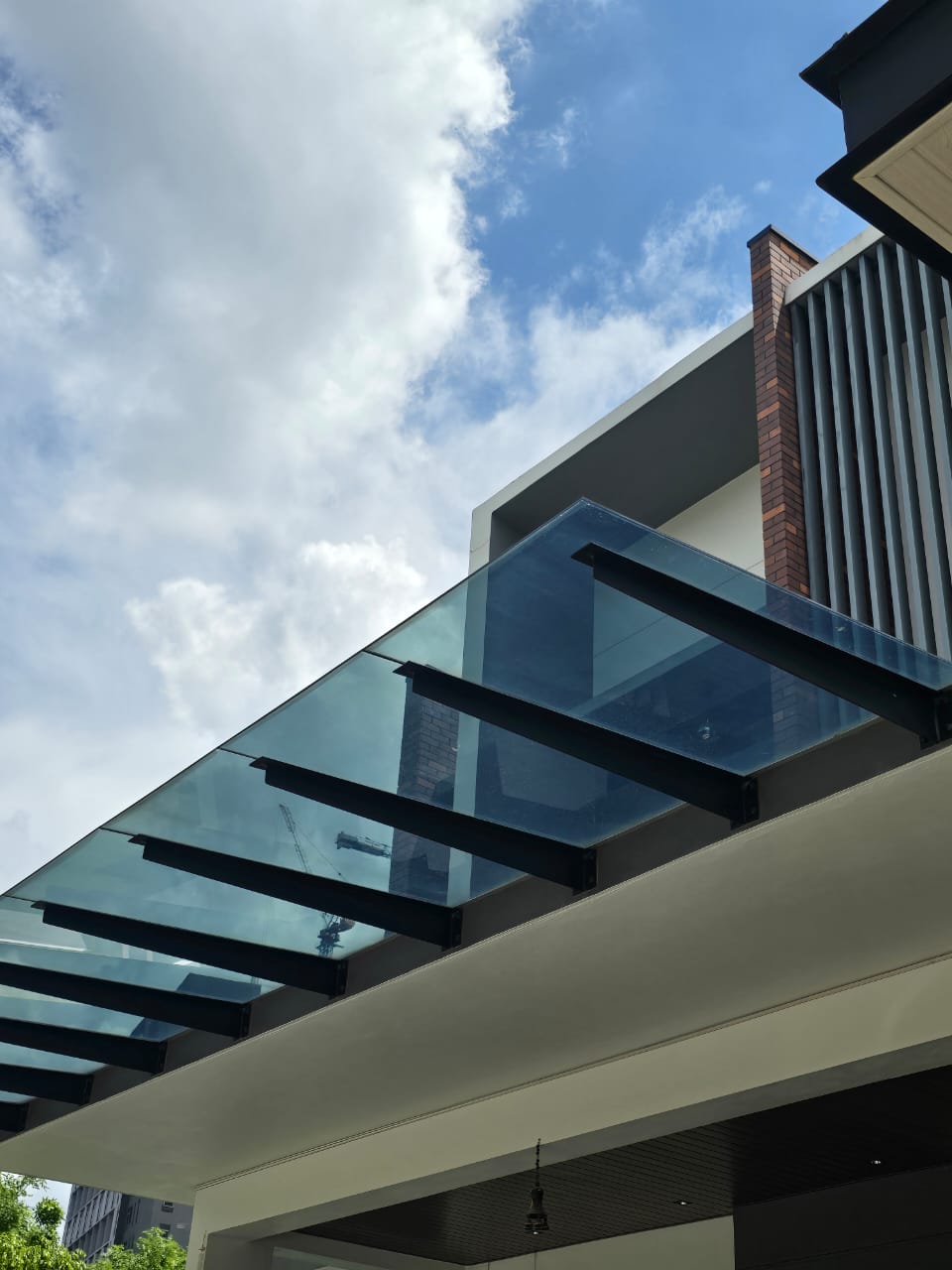 Tempered glass canopy awning letting daylight through