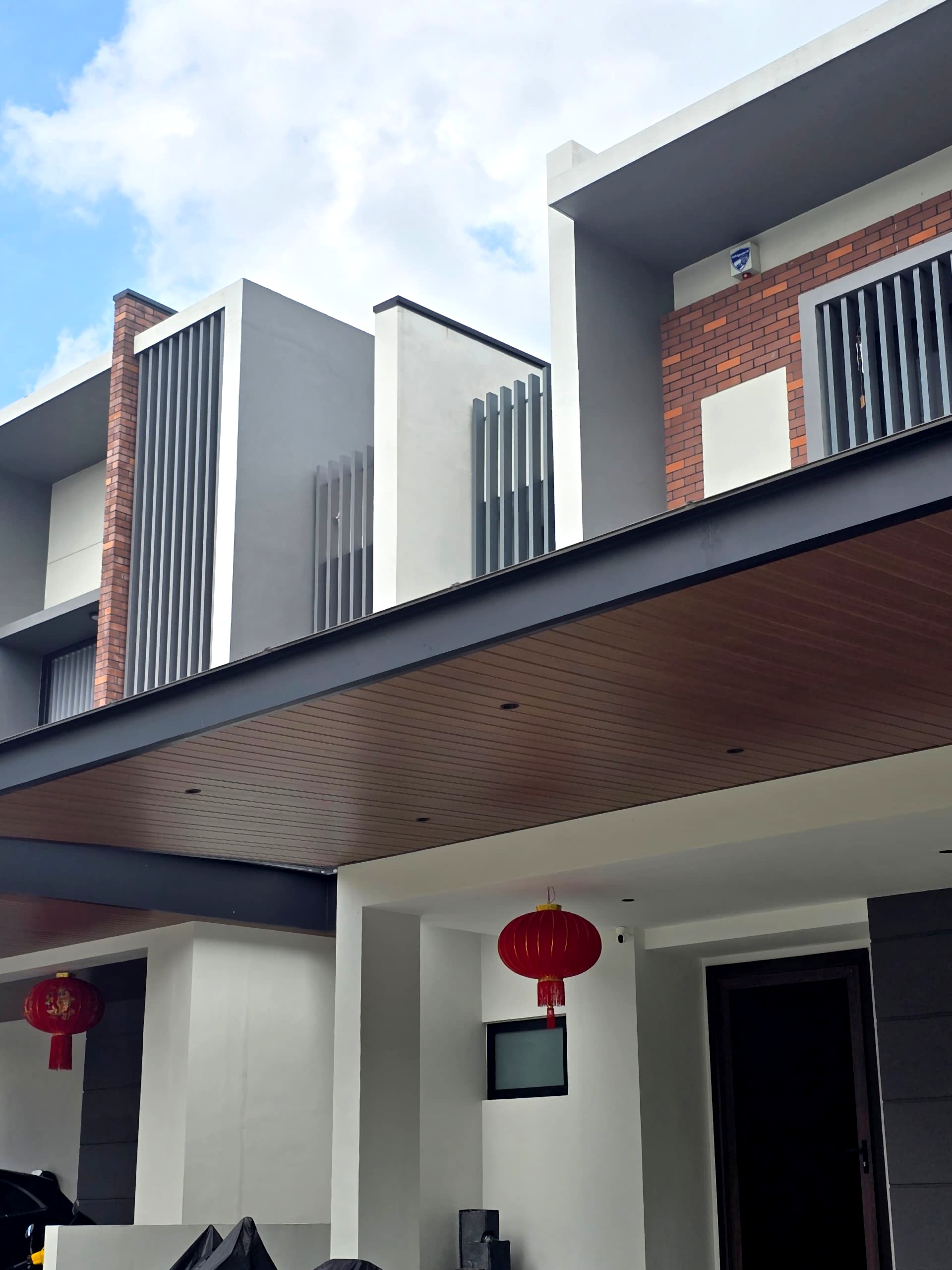 Modern residential house with premium ACP awning and black railings