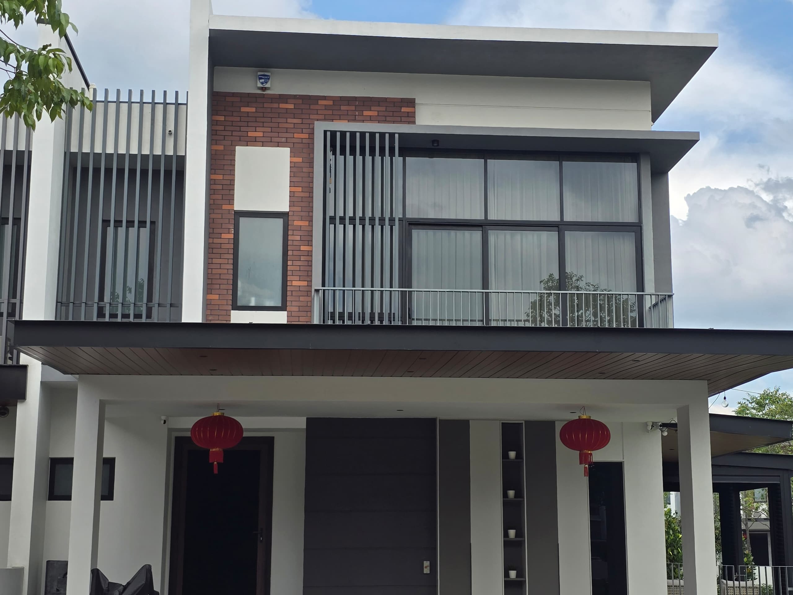 Modern carport with dark ACP soffit awning showing professional finish